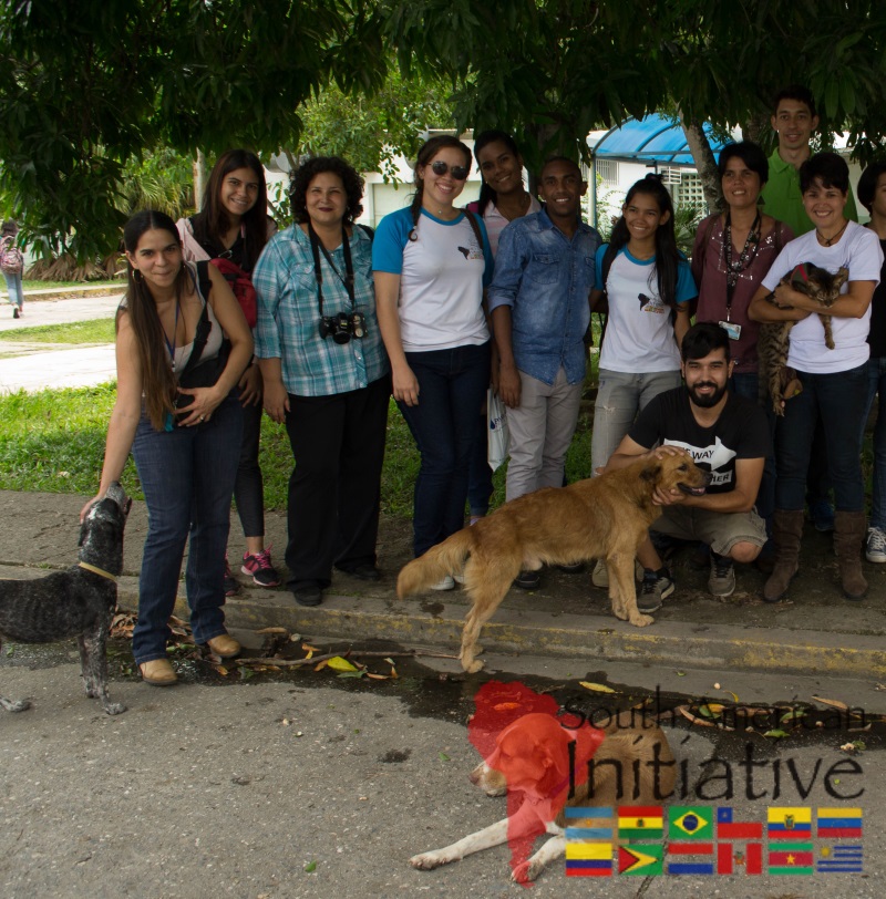 A group of SAI volunteers and supporters standing with rescued dogs during a pet rescue effort in Venezuela.
